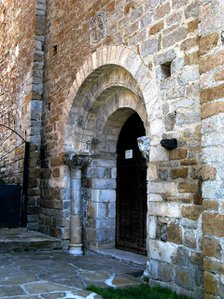 West Portal of the church of Santa Maria in Cap d'Aran Tredós, the portal has three round arches …