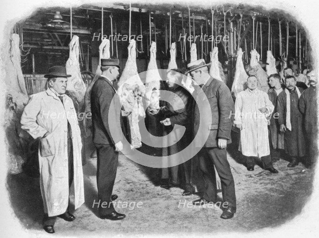 Inspecting meat at Smithfield Market, City of London, c1903 (1903). Artist: Unknown.