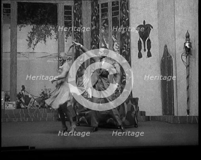 Scene from a Stage Show: Male and Female Civilian Dancing on a Stage in a Routine with..., 1929. Creator: British Pathe Ltd.