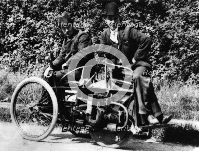 Herbert Austin (left) on 1897 Wolseley Tricar. Creator: Unknown.