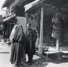 Muslim women talking to a man, Bosnia-Hercegovina, Yugoslavia, 1939. Artist: Unknown