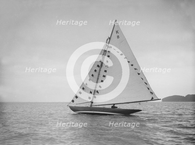 The 7 Metre sailing yacht 'Pinaster' (K8) with prize flags, 1912. Creator: Kirk & Sons of Cowes.