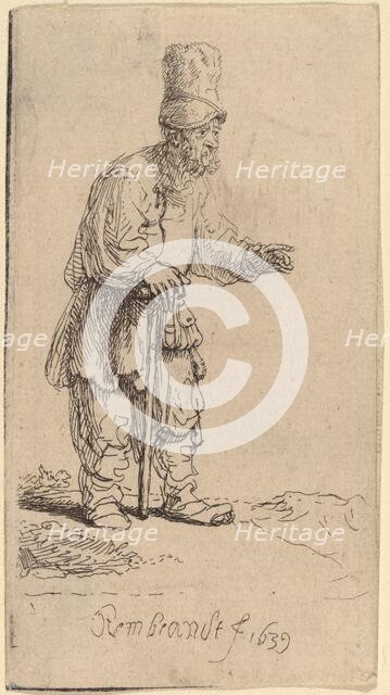 A Peasant in a High Cap, Standing Leaning on a Stick, 1639. Creator: Rembrandt Harmensz van Rijn.