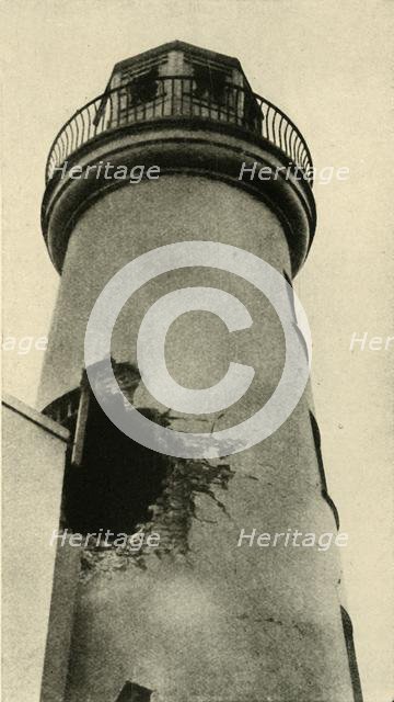 Scarborough lighthouse hit by a German bomb, First World War, December 1914, (c1920). Creator: Unknown.