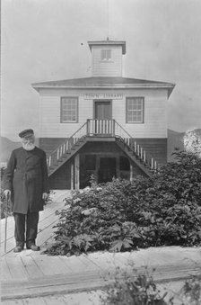 Father William Duncan, a missionary, in front of town library, between c1900 and 1923. Creator: Unknown.