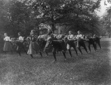 Classroom scenes in Washington, D.C. public schools - outdoor exercise with rods..., (1899?). Creator: Frances Benjamin Johnston.