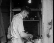 British Cooks Preparing Food for Soldiers Aboard a Ship Evacuating Dunkirk, 1940. Creator: British Pathe Ltd.