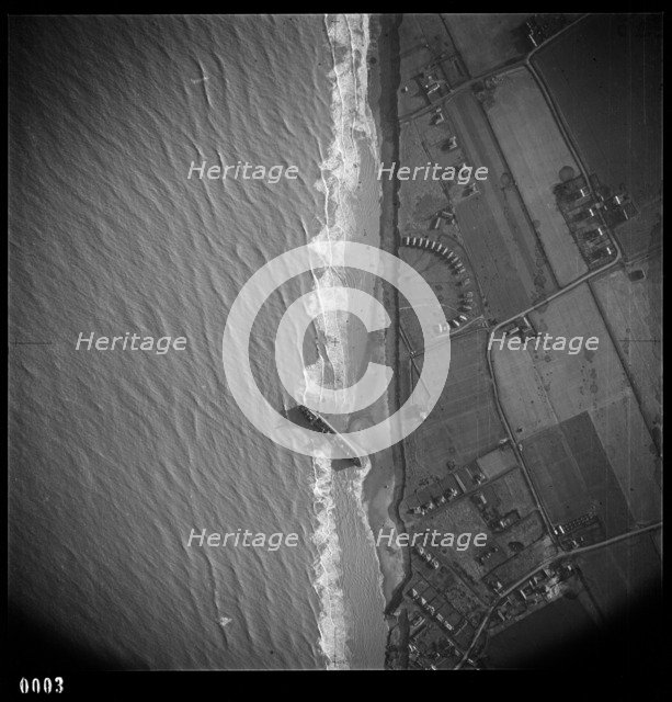 RFA tanker Olcades, beached following a high spring tide and massive gales, Walcot, Norfolk, 1953. Artist: RAF photographer.