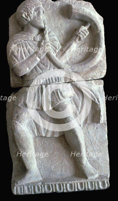 Detail from a Spanish frieze showing a man with a horn. Artist: Unknown