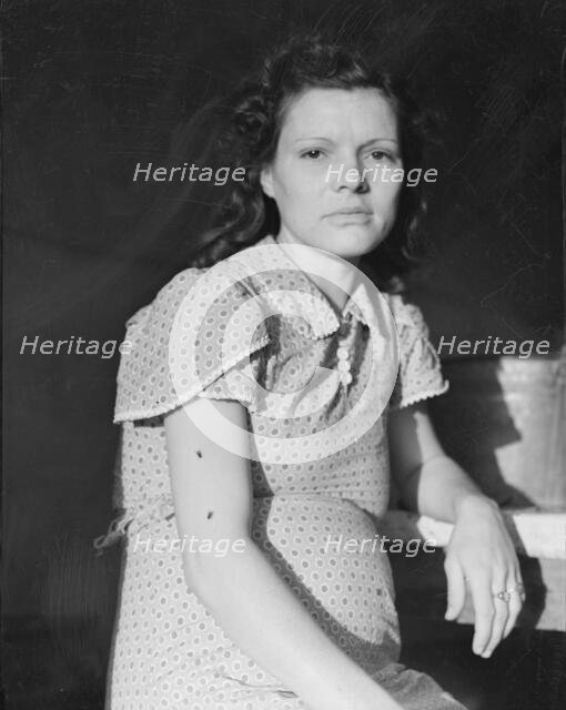 Daughter of migratory family in FSA labor camp, Calpatria, Imperial Valley, California, 1939. Creator: Dorothea Lange.