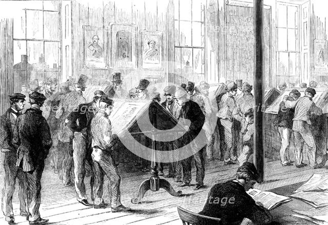 The Cotton Famine: operatives reading the latest news from America in Camp-field free library, 1862 Creator: Unknown.