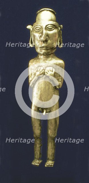 Empty anthropomorphic figure made of silver representing a male person with his arms across his c…