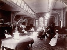 Claybury Asylum, Woodford, Essex: a nurses' day-room (?), (1893?). Creator: London & County Photographic Co.