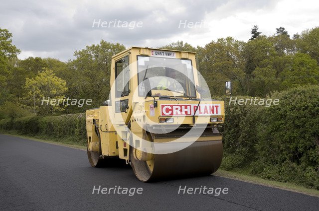 Road resurfacing work repairing potholes Artist: Unknown.