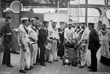 Issuing rum on board HMS 'Royal Sovereign', 1896. Artist: W Gregory