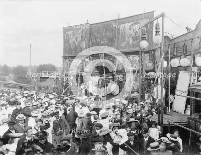 Exterior general view of Purchases Menagerie and crowd at Witney Fair, Oxfordshire, 1860-1922. Creator: Henry Taunt.