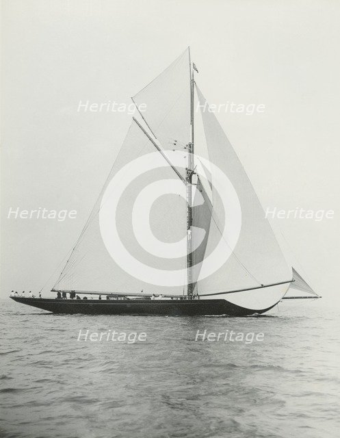 The 221 ton gaff-rigged cutter 'Britannia' sailing under spinnaker. Creator: Kirk & Sons of Cowes.