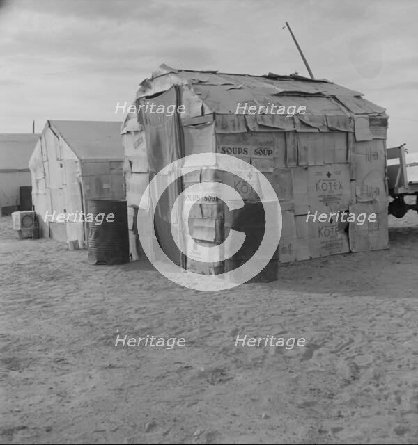 Migratory field worker's home on the edge of a pea field, Imperial Valley, California, 1937. Creator: Dorothea Lange.