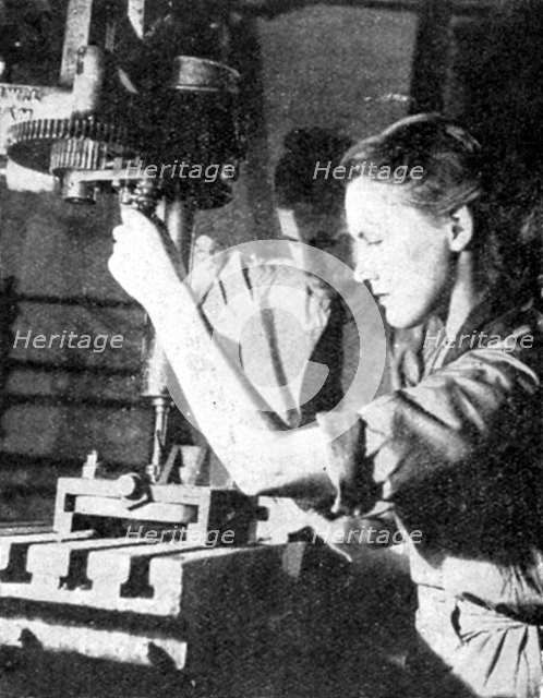 Woman armaments worker, World War II, 1940. Artist: Unknown