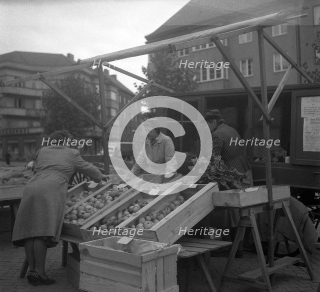 Fruit and vegetable stall in the market, Malmö, Sweden, 1947. Artist: Otto Ohm