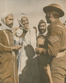 'Tunisian Arabs Welcome a British Sergeant at Chaouach', 1943. Artist: Unknown.