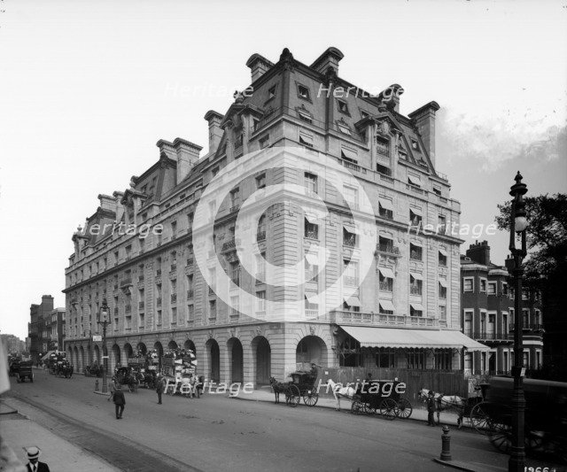 Horse drawn omnibuses and cabs pass the Ritz Hotel, Piccadilly, London, 1906. Artist: Bedford Lemere and Company