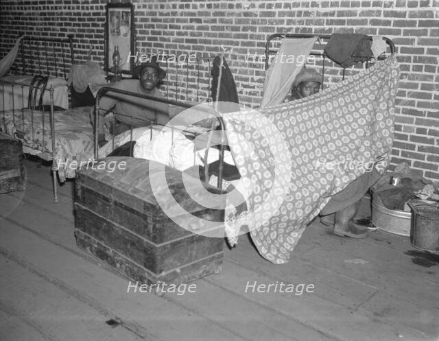 Negro flood refugees in the Red Cross temporary infirmary at Forrest City, Arkansas, 1937. Creator: Walker Evans.