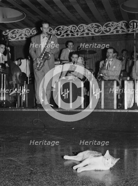 Portrait of Sam Donahue and Hep, Aquarium, New York, N.Y., ca. Dec. 1946. Creator: William Paul Gottlieb.