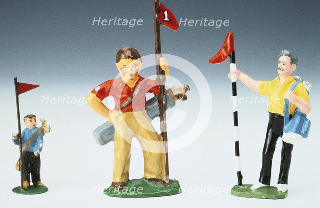 Lead golf caddy figures, 20th century. Artist: Unknown