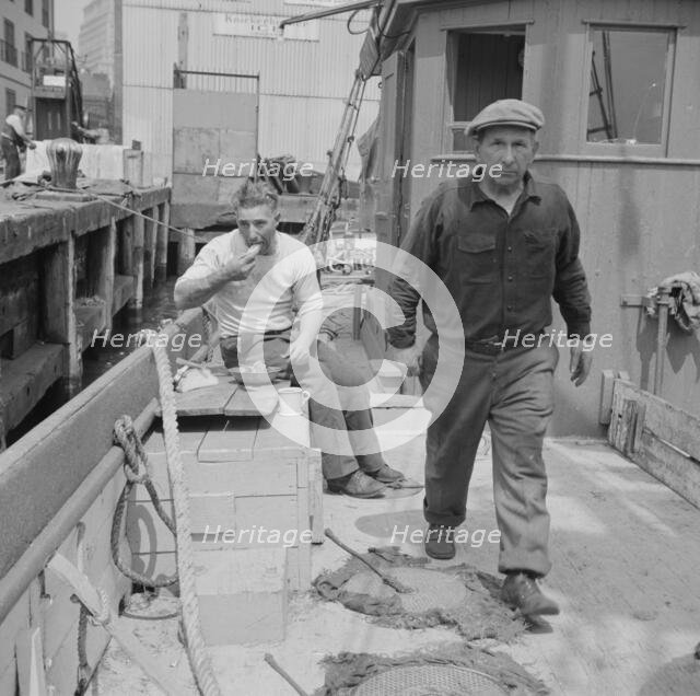 New England fisherman aboard their ship at Fulton fish market, New York, 1943. Creator: Gordon Parks.