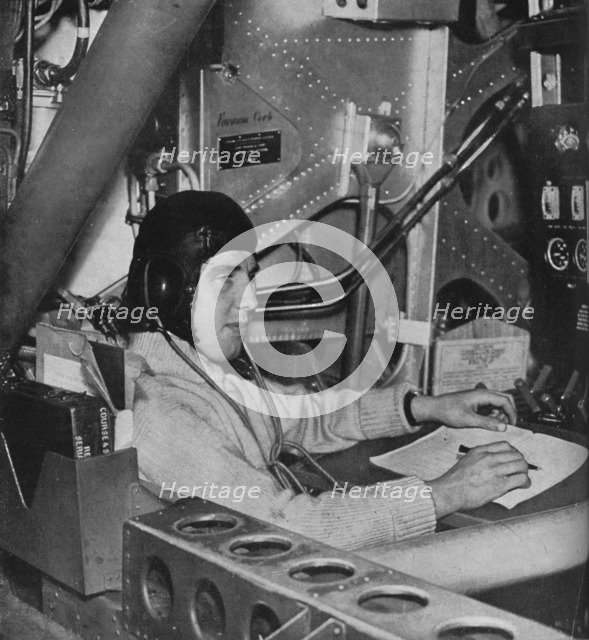 RAF flight engineer on board an aircraft, c1940 (1943). Artist: Unknown.