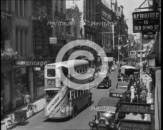 Traffic and Crowds Moving Through Old Bond Street, 1930s. Creator: British Pathe Ltd.