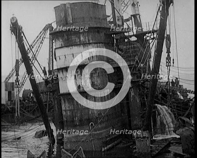 German Battleships Being Salvaged in Scapa Flow, 1926. Creator: British Pathe Ltd.