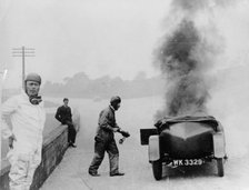 Car on fire, Brooklands, Surrey, 1928. Artist: Unknown