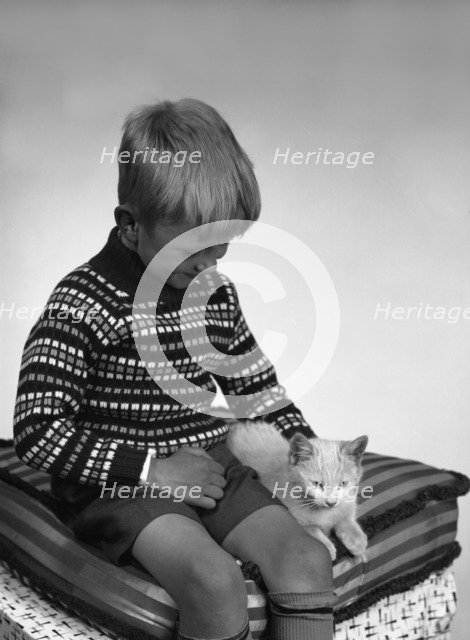 Child with a cat, 1963. Artist: Michael Walters