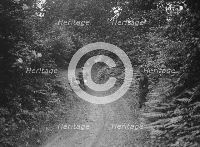 Motorcycle and sidecar, B&HMC Brighton-Beer Trial, Simms Hill, Ilsington, Devon, 1930. Artist: Bill Brunell.