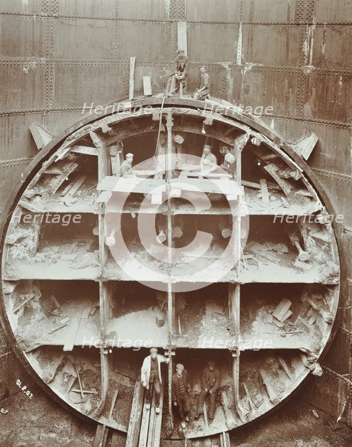 Men standing in the cutting shield, Rotherhithe Tunnel, Stepney, London, August 1907. Artist: Unknown.