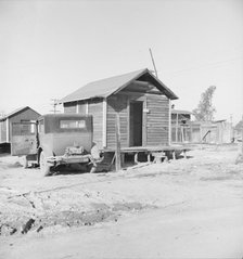 Newly-built cabins, rent five dollars per month, near Bakersfield, California , 1939. Creator: Dorothea Lange.