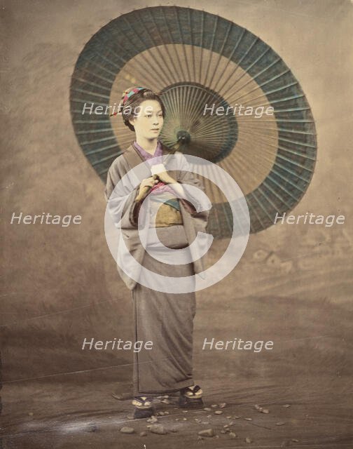 Japanese woman holding a large parasol, 1868-1880. Creator: Felice Beato.