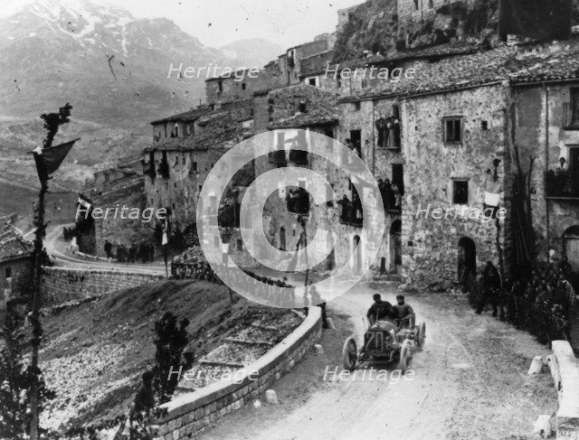 Felice Nazzaro driving through Pettralia Sottana in a Fiat, in the Targa Florio race, Sicily, 1907. Artist: Unknown