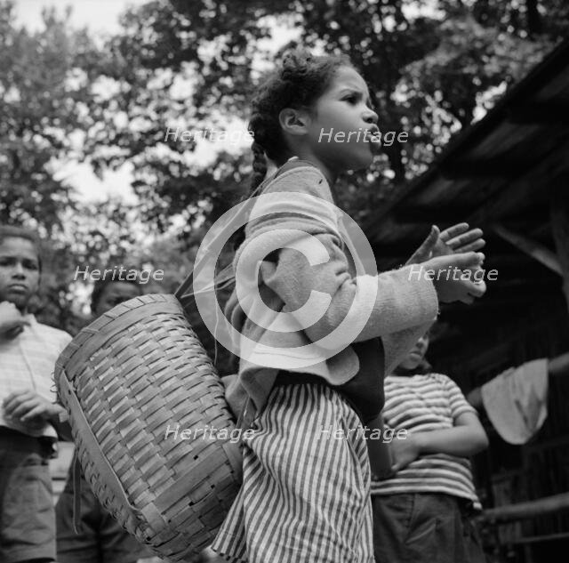 Michailyn calling her buddie Marie at Camp Fern Rock, Bear Mountain, New York, 1943 Creator: Gordon Parks.
