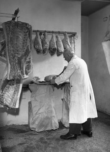 Dressing meat for sale, Rawmarsh, South Yorkshire, 1955. Artist: Michael Walters
