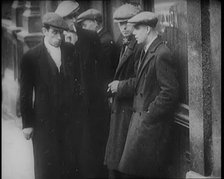 Male Civilians Standing in the Streets, 1926. Creator: British Pathe Ltd.