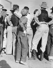 Watching ball game, Shafter migrant camp, California, 1938. Creator: Dorothea Lange.