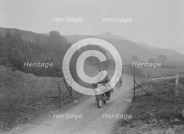 493 cc Triumphs of L Crisp and KP Jones competing in E&DMC Scottish 6 Days Trial, 1933.. Artist: Bill Brunell.