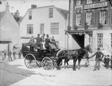 Horse drawn bus with passengers outside the Bull Hotel, Burford High Street, Oxon, c1860-c1922. Artist: Henry Taunt