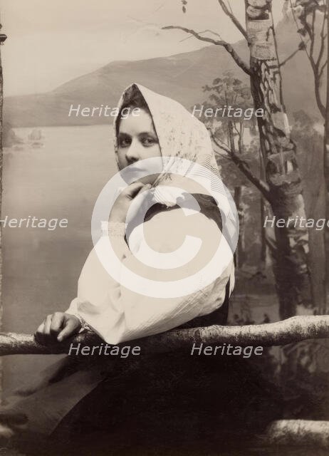 Photograph of a young girl in a white blouse and white headscarf, 1880-1890. Creator: Helene Edlund.