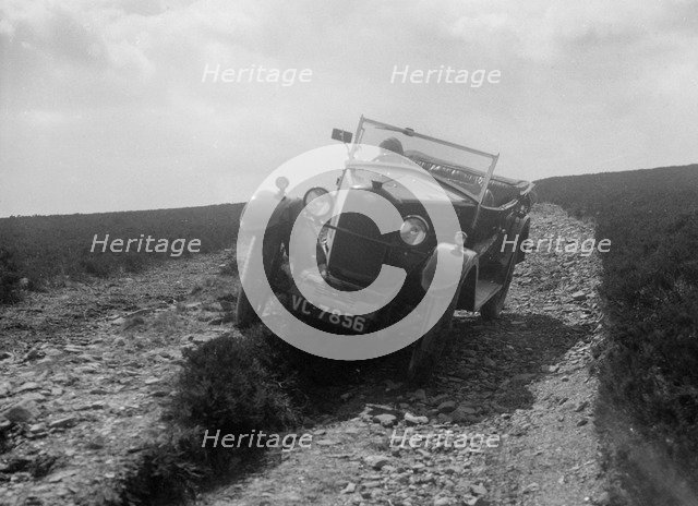 Kitty Brunell road testing a Riley 9 WD tourer, c1930. Artist: Bill Brunell.