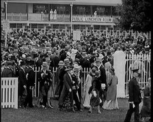 A Large Crowd of Smartly Dressed People in Hats at Ascot Horse Racing Track, 1931. Creator: British Pathe Ltd.