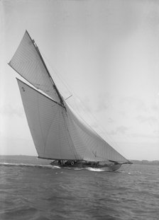 The 40-rater cutter 'Carina' heeling in good wind, 1911. Creator: Kirk & Sons of Cowes.
